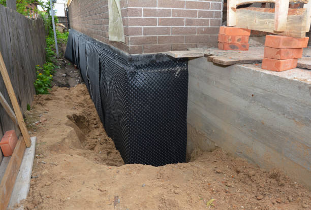 SJ Waterproofing Pros technician performing targeted Basement Waterproofing assessment in Medford, NY